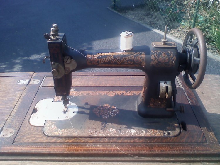 White Family Rotary Sewing machine on table.