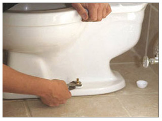 Toilet flushes (seemingly) but water comes out of 2 holes ...