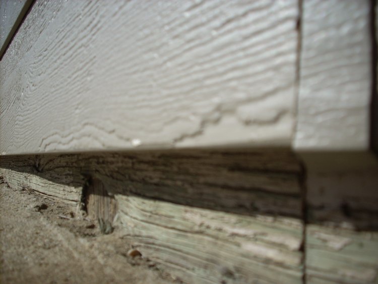 Gap between siding and underground.