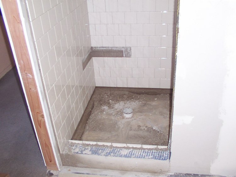 Shower pan weep holes
