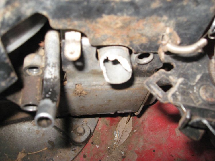 Broken plastic manifold intake on gas mower